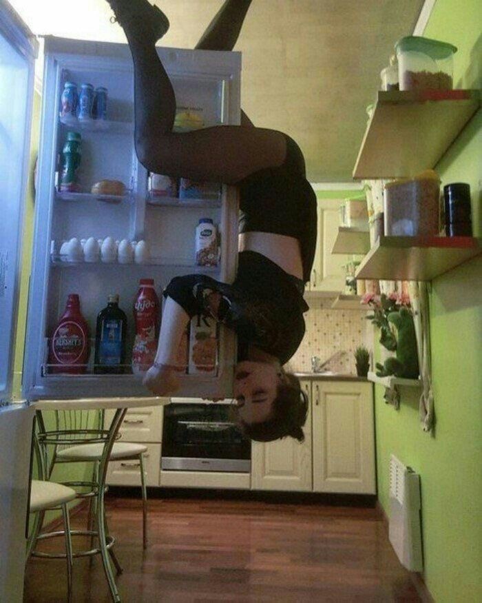 Girl Hanging from Fridge Door 