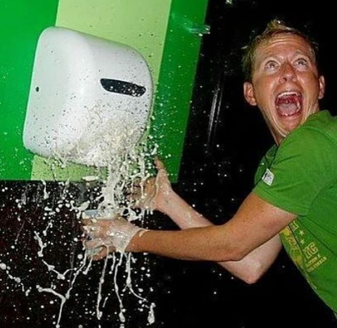 Man Using Hand Dryer as Drink Chiller