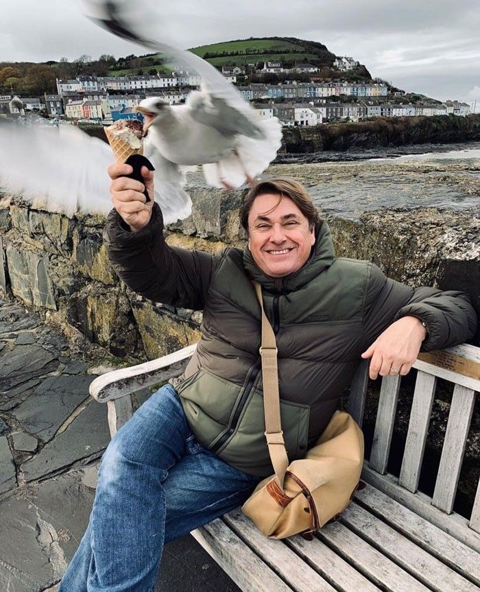 Man Posing with Ice Cream, Seagull Attacks