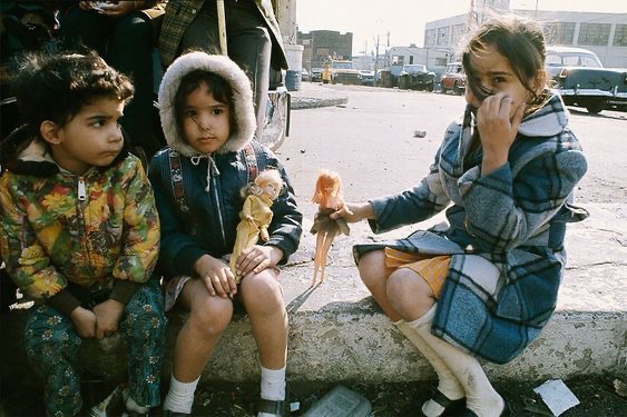 Children Playing with Dolls in the Street