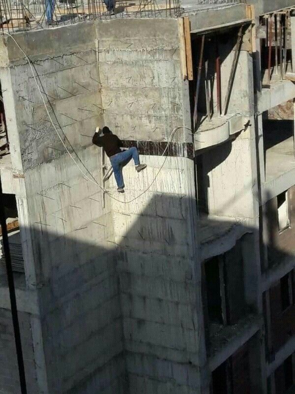 Man Becomes Spiderman on Building