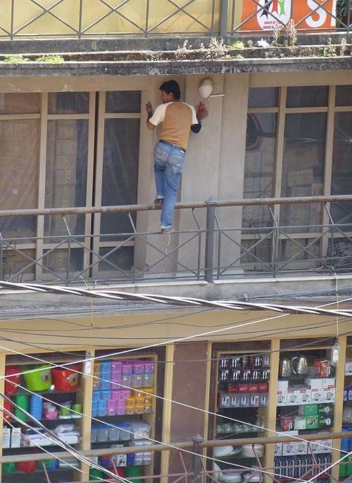 Feet Dangling Off Balcony