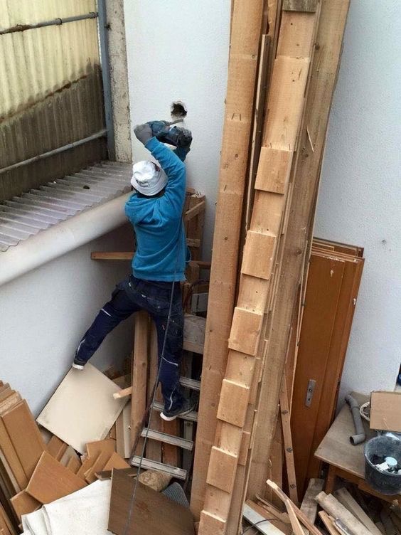 Man Drills Wall in Impossible Pose