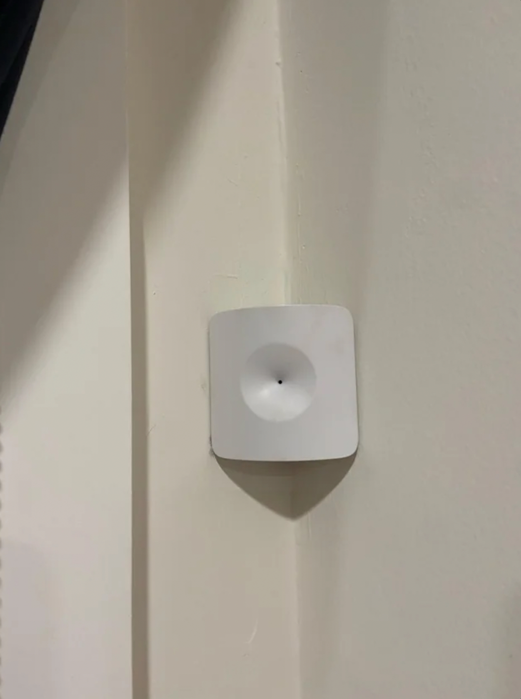 “—This is in the corner of the master bedroom in the house we’re renting, pretty sure it’s not a camera, but what is it?”