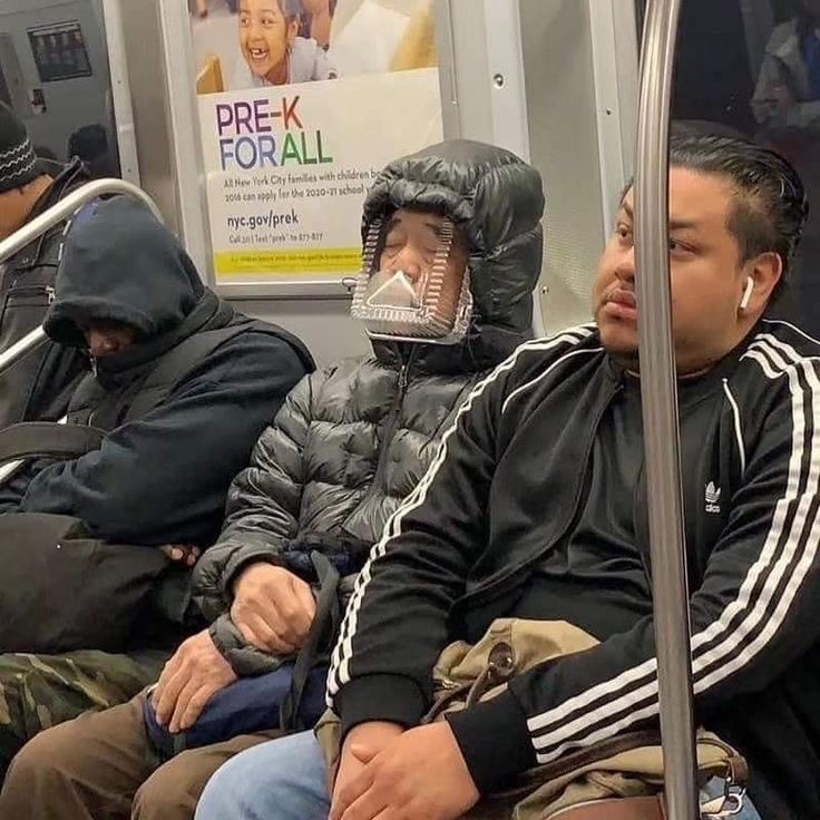 Guy Using a Plastic Tray as Subway Face Armor