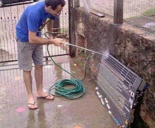 Man Watering a Sound Console