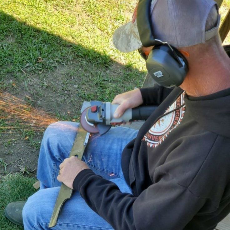Man Cutting Sparks Straight Toward His Own Thigh