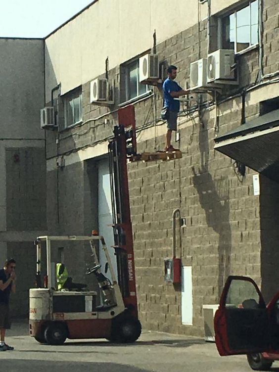 Guy Riding the Truck’s Lift 