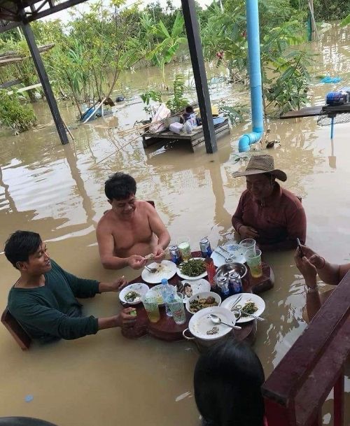 Men Having Lunch in a Flood
