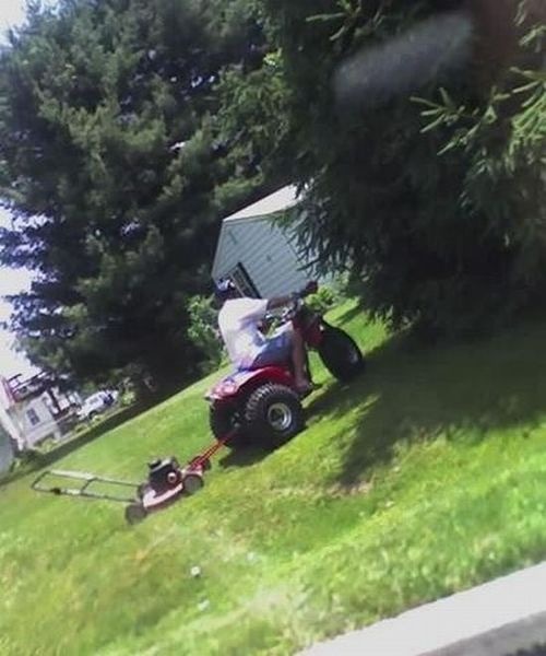 Man Mowing the Lawn With a Giant Tricycle