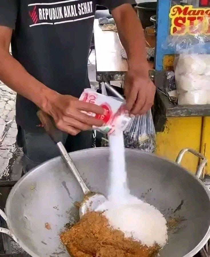 Man Dumping an Entire Bag of Salt Into Dinner