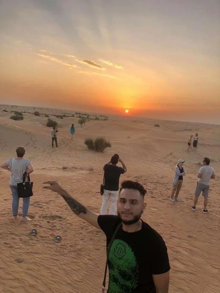 Boy Pretending to Hold the Sun From 20 Feet Away