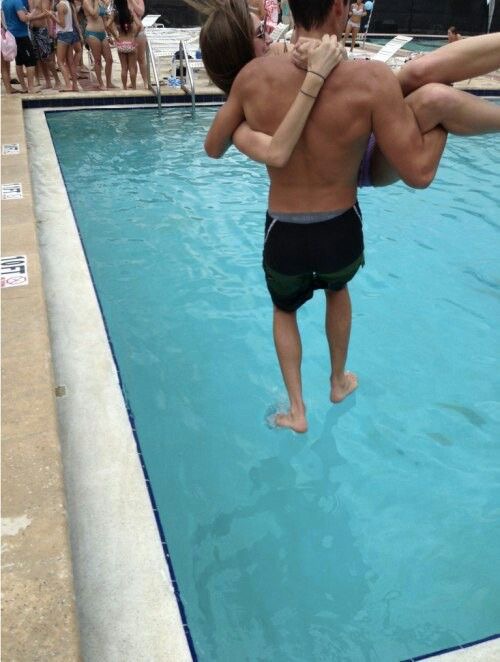 Boy Walking on Water With a Girl in His Arms