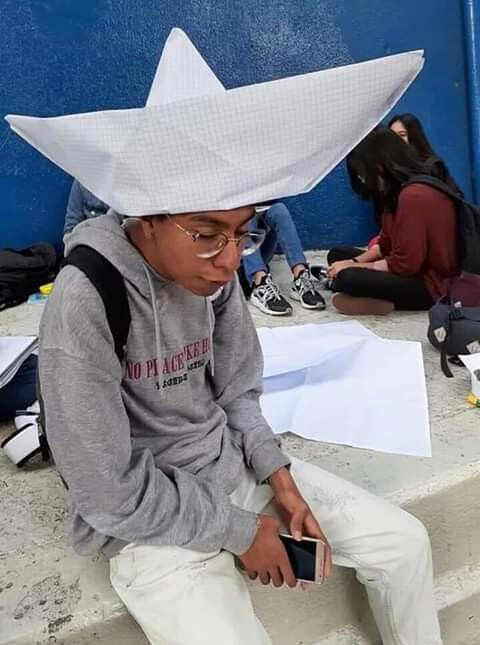 Boy Wearing an Enormous Paper Hat