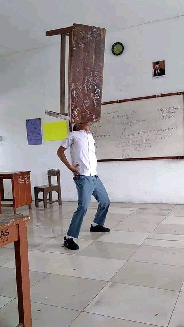 Boy Holding a Table with His Mouth
