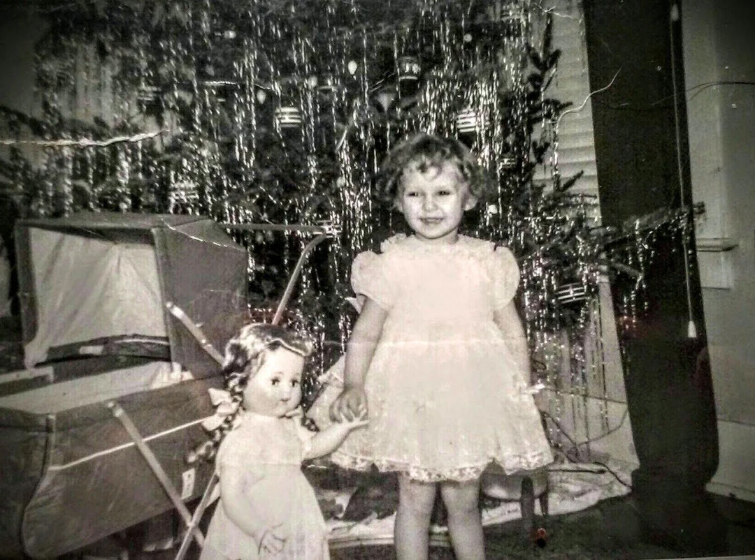 Little girl with Christmas doll