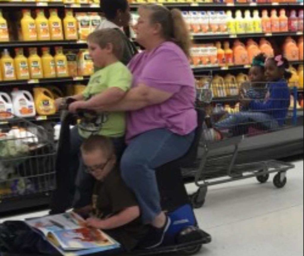 Woman on Electric Scooter With Kids