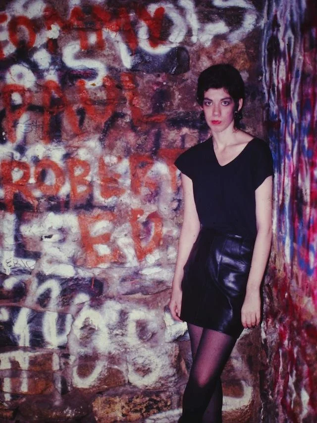 Against the graffiti wall