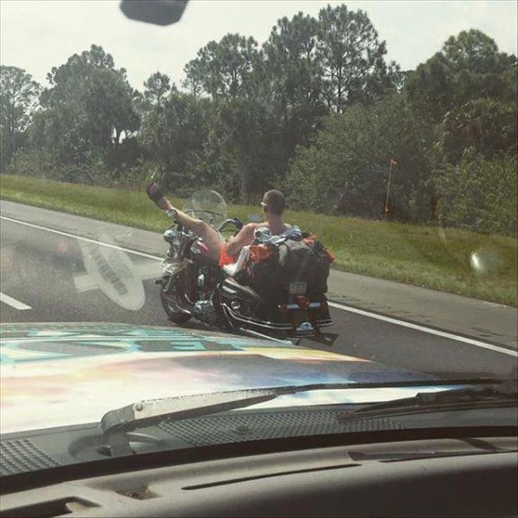 Man Lying on His Motorcycle