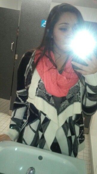 Girl Posing in a Bathroom with a Man Visible