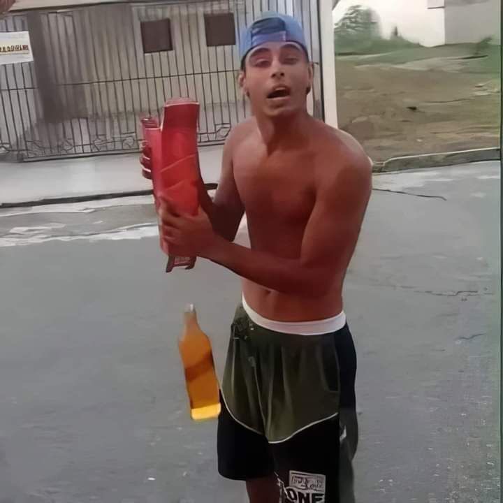 Guy Posing with a Whiskey Box as the Bottle Falls