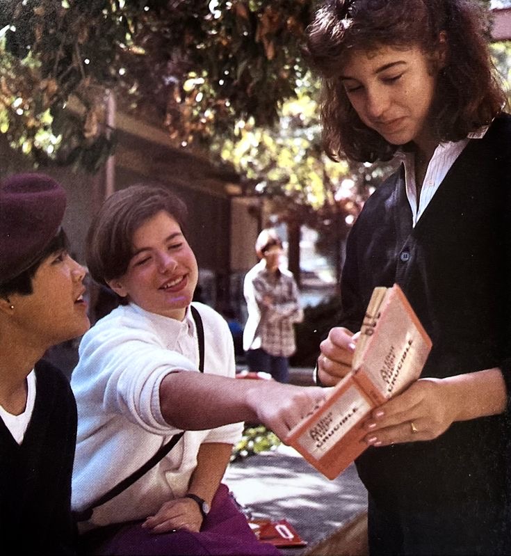 Friends Holding a Book
