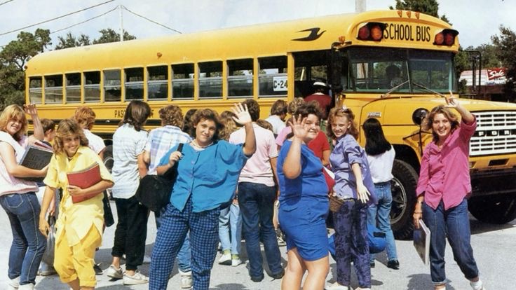 Girls Waving While Going to the Bus