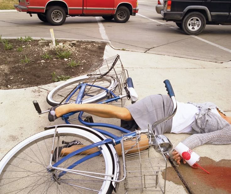 Girl Falls Off Bike While Holding Juice