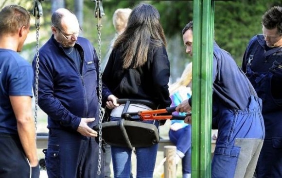 Grown Woman Completely Stuck in a Toddler Swing
