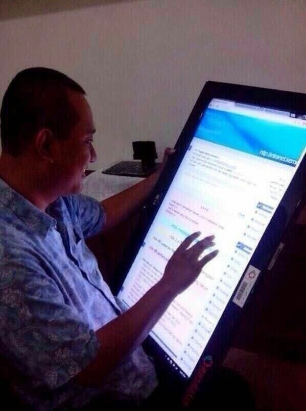 Man Using an Oversized Giant Cell Phone