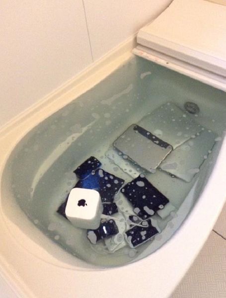 Person Washing Their Electronics in the Bathtub