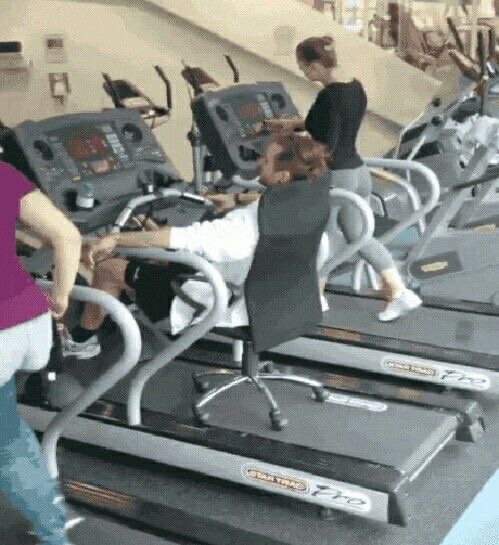 Boy Sitting in a Chair on Top of a Treadmill