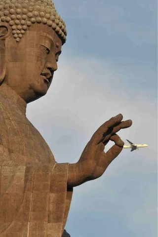 Buddha pinching a plane