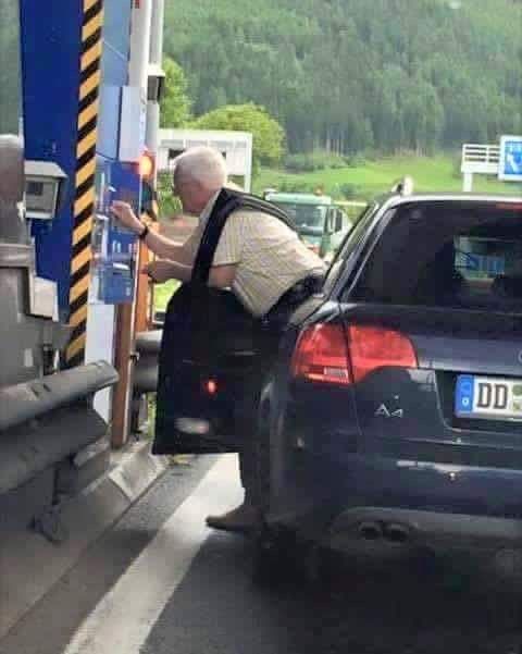 Man Opens Car Door and Goes Through the Window