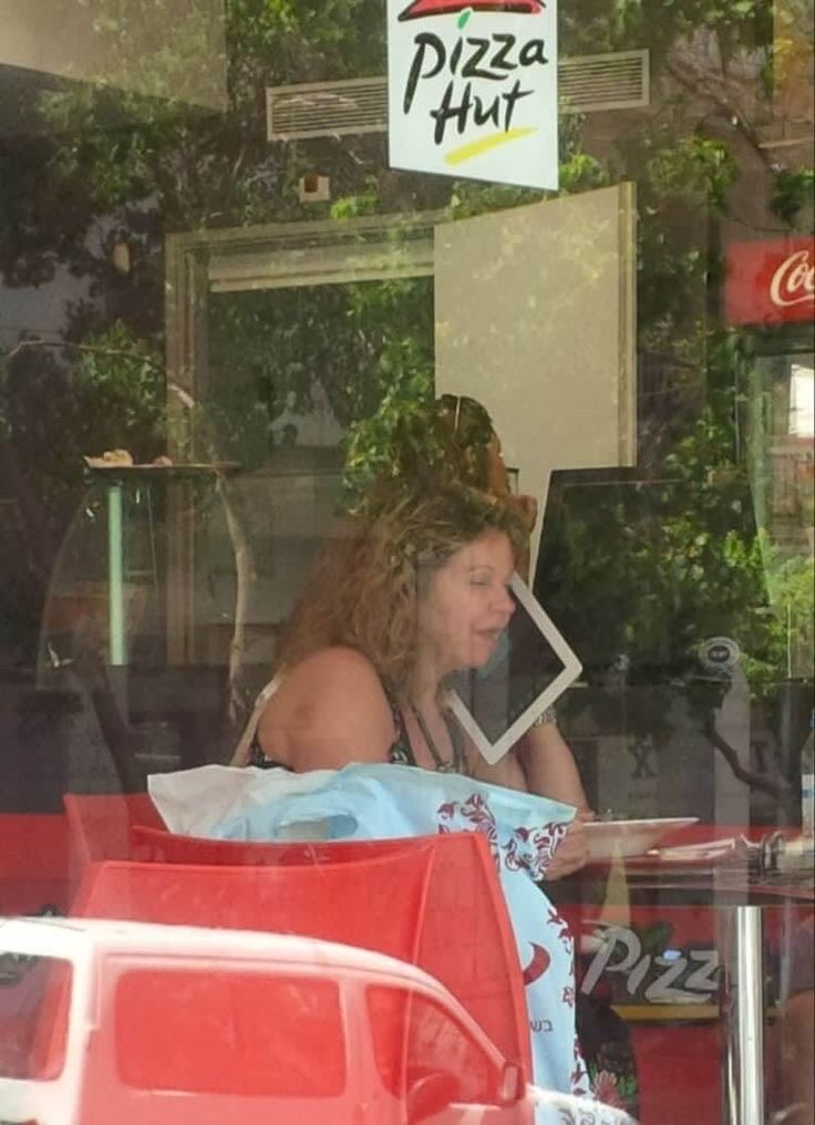 Woman Talking on an iPad Like It’s a Phone