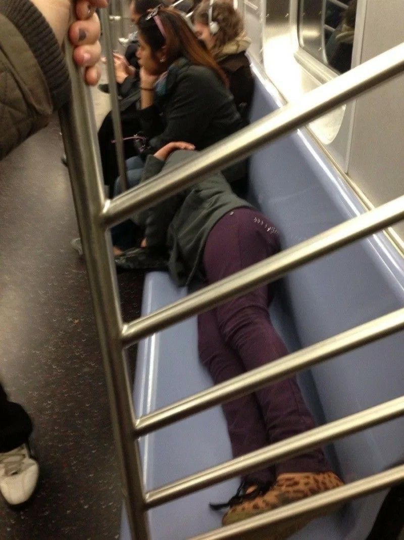 Person Sleeping On the Subway Seats