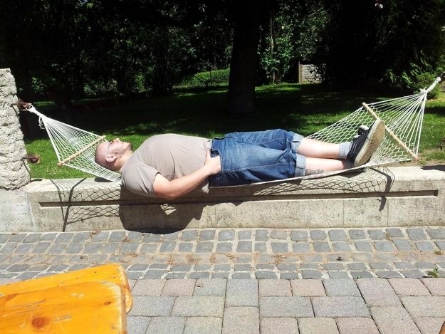 Man Lying on a Hammock That's Too Low
