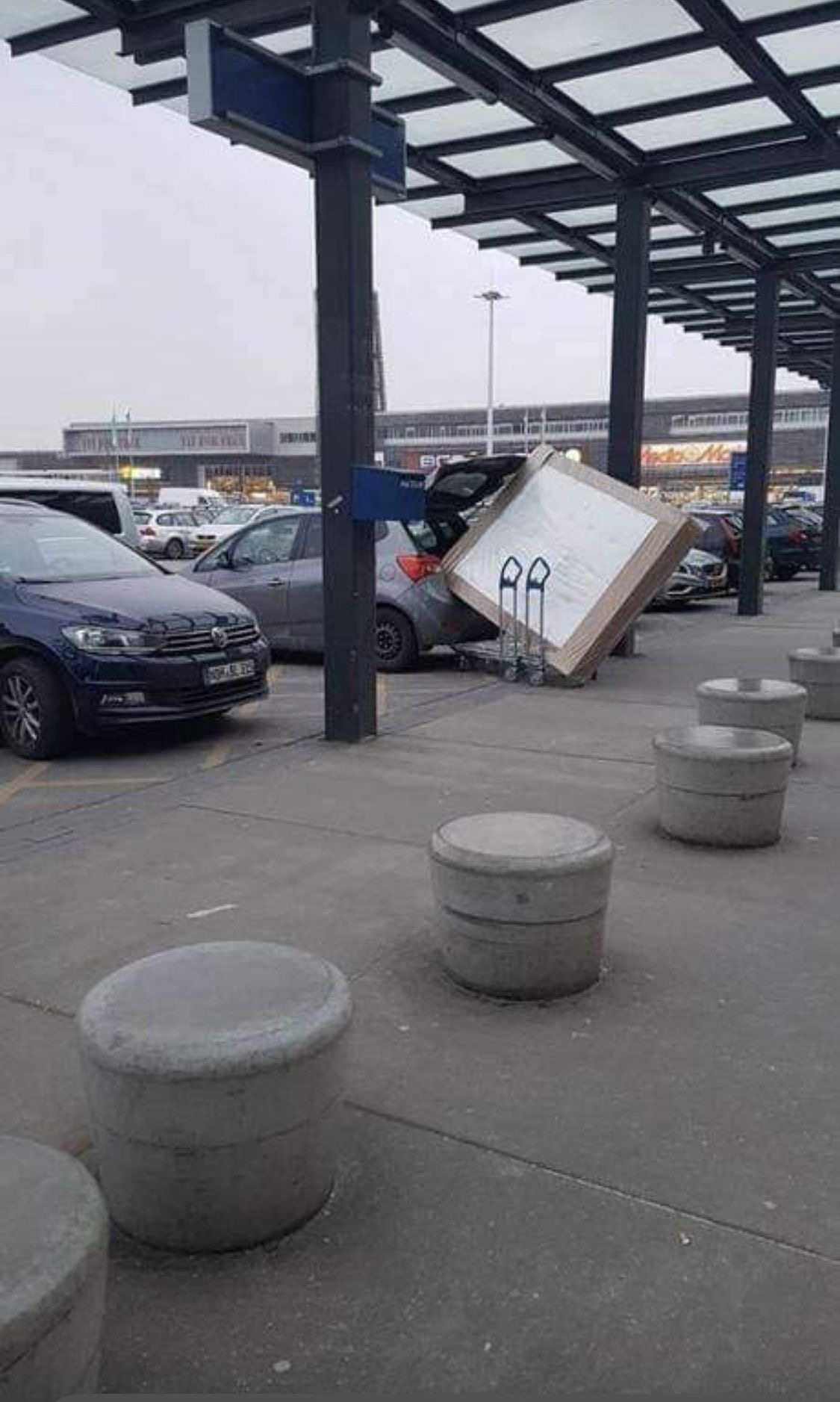 Forcing a Giant Box Into a Tiny Car Trunk