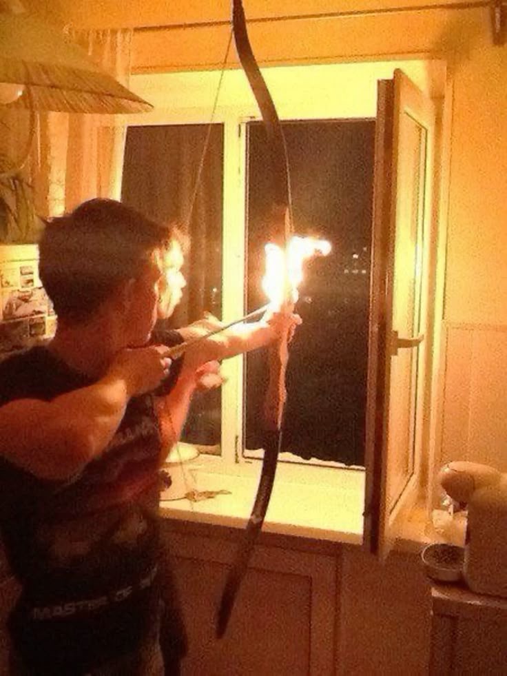 Kid Preparing to Shoot a Flaming Arrow