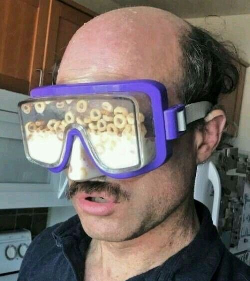 Man Wearing Swim Goggles Filled With Cereal and Milk