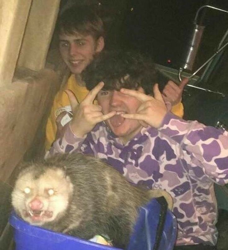 Kids Posing Cheerfully With One Very Terrified Raccoon