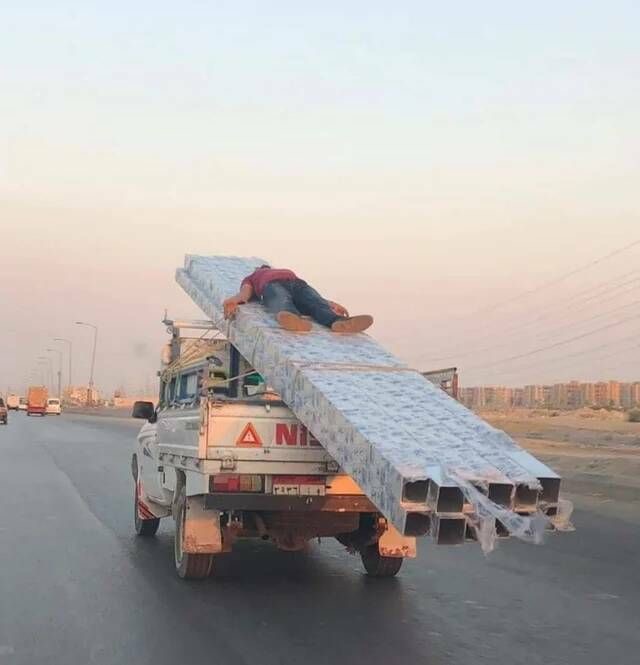 Man Lying Down While Holding Onto Some Things