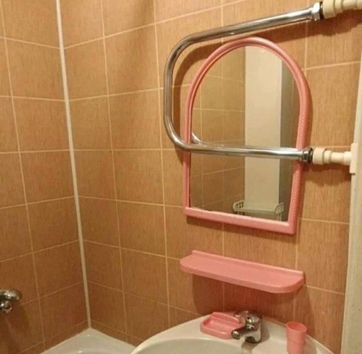 Bathroom Mirror Blocked by a Pipe 