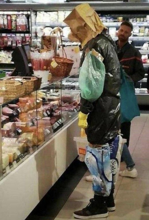 Man Uses Plastic Bags and Paper Bag as a Helmet