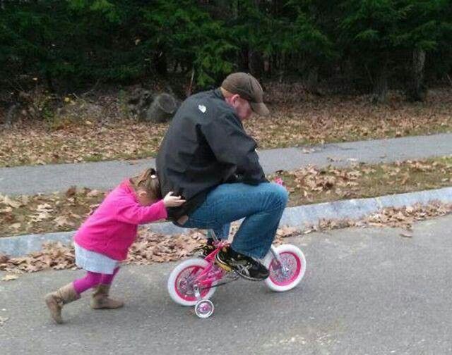 Dad Riding a Tiny Girl’s Bike