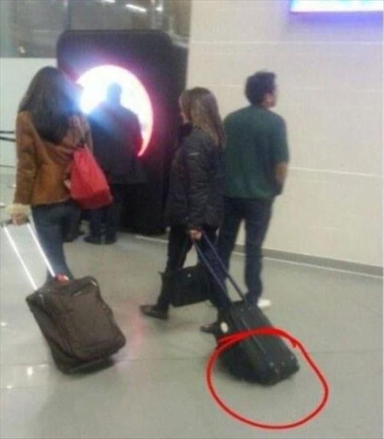 Girl Dragging a Suitcase All Wrong