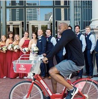 Wedding party and a cyclist