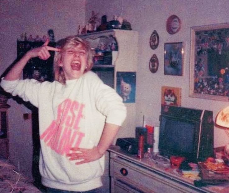Girl Laughing and Playing in Her Room
