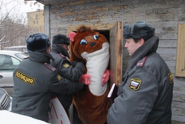 Police Arresting a Person in an Animal Costume