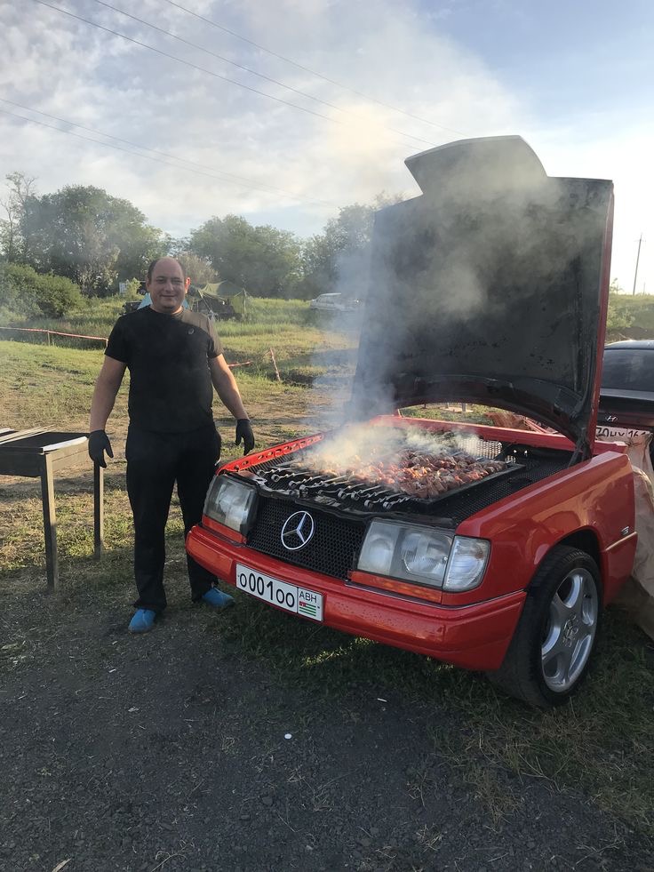 Man Grilling On His Car